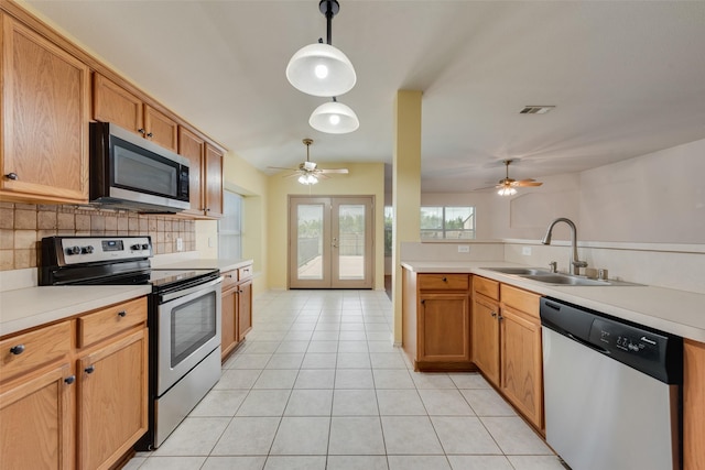 4305 Sonoma Dr, Denton, TX 76226 - kitchen with appliances with stainless steel finishes, a ceiling fan, backsplash, and french doors