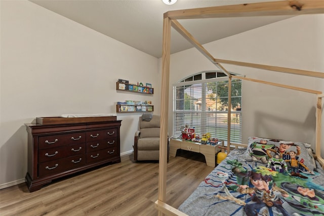 6625 Vista View Dr, Woodway, TX 76712 - bedroom with lofted ceiling and light wood-style flooring