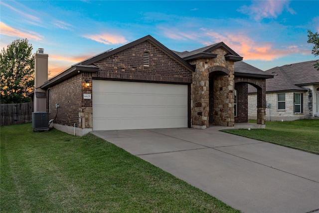 6625 Vista View Dr, Woodway, TX 76712 - view of front of home featuring an attached garage, a chimney, concrete driveway, and stone siding