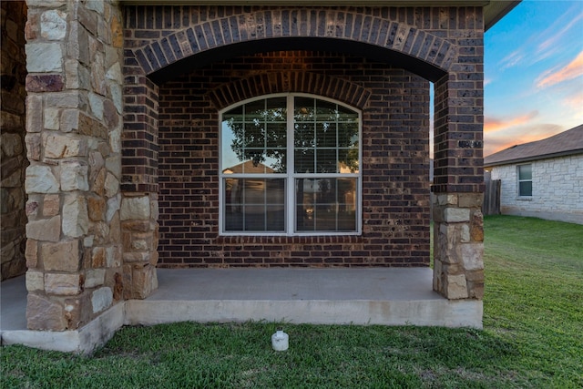 6625 Vista View Dr, Woodway, TX 76712 - exterior entry at dusk featuring brick siding and a yard