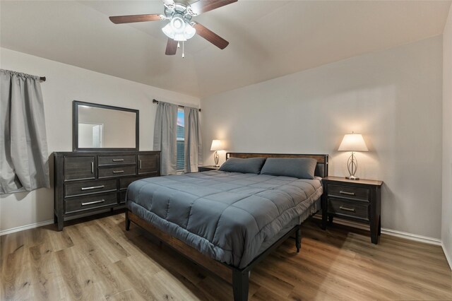 6625 Vista View Dr, Woodway, TX 76712 - bedroom with light wood-style flooring, lofted ceiling, and a ceiling fan