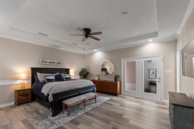 111 Hickory Creek Cir, Gun Barrel City, TX 75156 - bedroom with a tray ceiling, light wood-type flooring, recessed lighting, crown molding, and ceiling fan