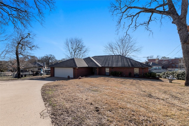 111 Hickory Creek Cir, Gun Barrel City, TX 75156 - view of front of home featuring an attached garage, concrete driveway, and brick siding