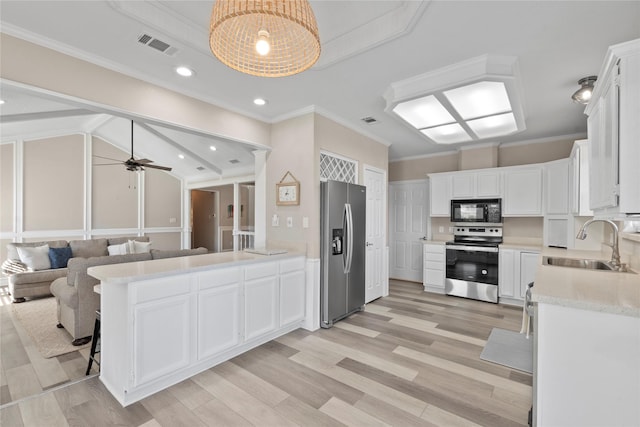 111 Hickory Creek Cir, Gun Barrel City, TX 75156 - kitchen featuring appliances with stainless steel finishes, light countertops, a ceiling fan, white cabinetry, and ornamental molding