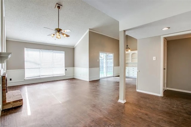 403 Gingerbread Ln, Waxahachie, TX 75165 - unfurnished living room with crown molding, ceiling fan, a fireplace, wood finished floors, and lofted ceiling