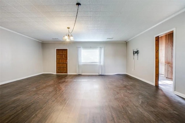 403 Gingerbread Ln, Waxahachie, TX 75165 - spare room featuring crown molding, a chandelier, and dark wood-style flooring