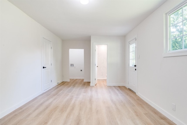118 W Wanda Dr, Garland, TX 75040 - unfurnished room featuring light wood-type flooring and baseboards