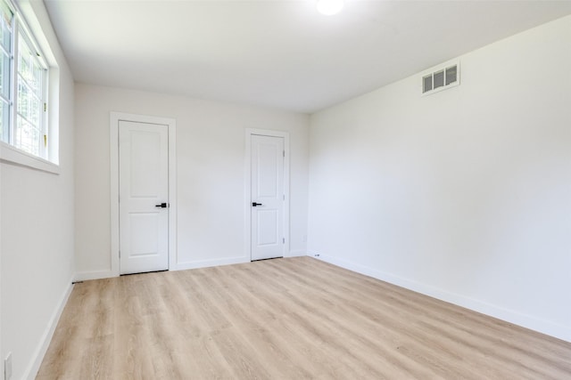118 W Wanda Dr, Garland, TX 75040 - unfurnished bedroom featuring light wood-style flooring and baseboards