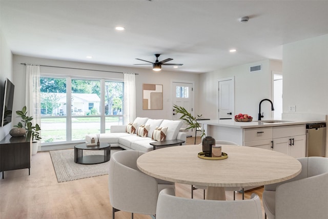 118 W Wanda Dr, Garland, TX 75040 - dining space featuring plenty of natural light, ceiling fan, light wood-type flooring, and recessed lighting