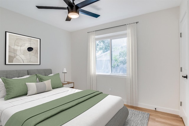 118 W Wanda Dr, Garland, TX 75040 - bedroom featuring light wood finished floors and a ceiling fan