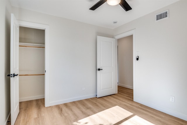118 W Wanda Dr, Garland, TX 75040 - unfurnished bedroom with wood finished floors, a closet, and ceiling fan
