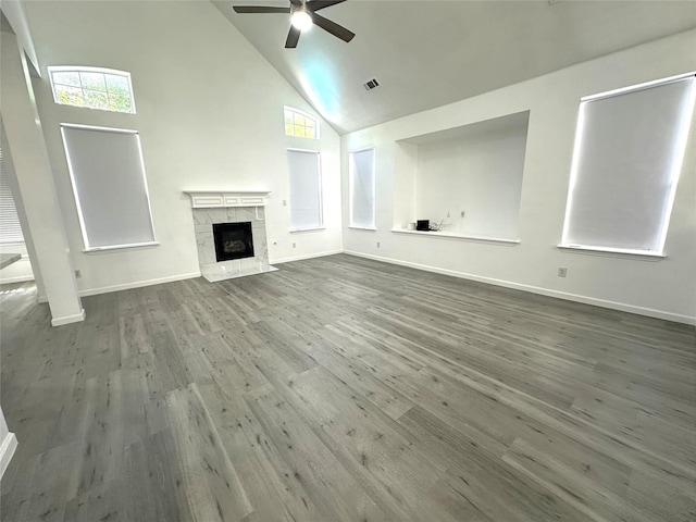4201 Iron Ln, Mansfield, TX 76063 - unfurnished living room featuring high vaulted ceiling, ceiling fan, dark wood finished floors, and a premium fireplace