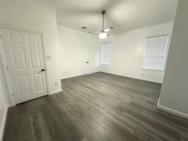 4201 Iron Ln, Mansfield, TX 76063 - unfurnished bedroom featuring dark wood finished floors, a closet, and ceiling fan