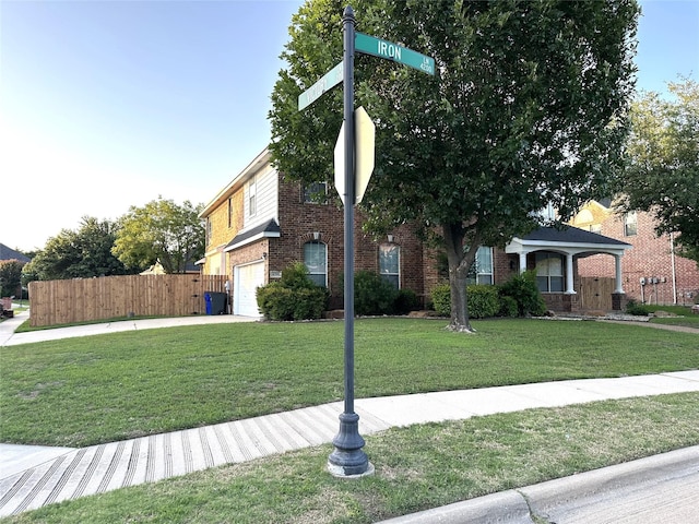 4201 Iron Ln, Mansfield, TX 76063 - view of front of house featuring brick siding, a garage, and driveway