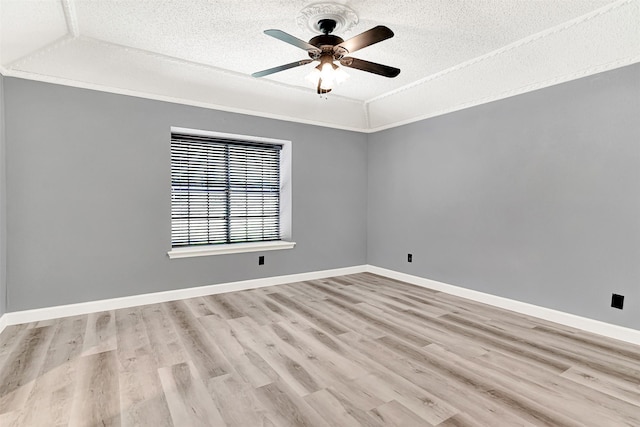 4005 Azalea Ln, Garland, TX 75043 - unfurnished room featuring a textured ceiling, light wood-style flooring, and ceiling fan