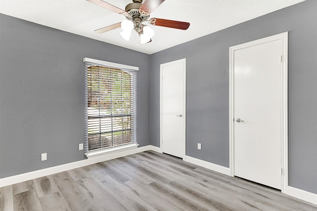 4005 Azalea Ln, Garland, TX 75043 - unfurnished bedroom with wood finished floors and ceiling fan