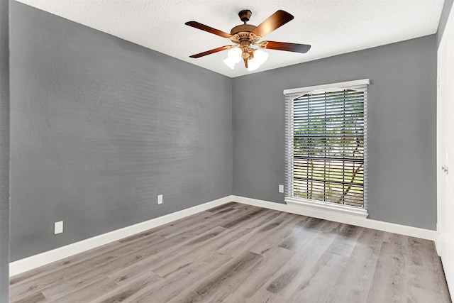 4005 Azalea Ln, Garland, TX 75043 - empty room with wood finished floors, a ceiling fan, and a textured ceiling