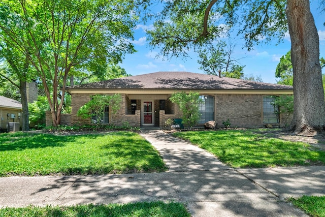 4005 Azalea Ln, Garland, TX 75043 - ranch-style home featuring brick siding, a front yard, a carport, and driveway