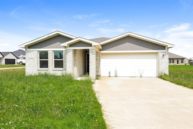2719 William St, Mabank, TX 75147 - ranch-style home with brick siding, concrete driveway, and an attached garage
