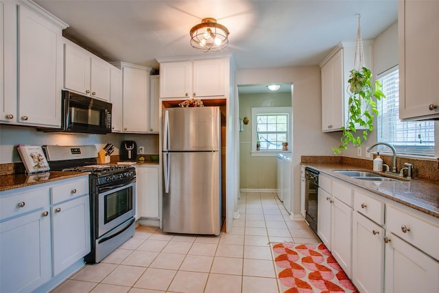 1211 Lansford Ave, Dallas, TX 75224 - kitchen with black appliances, white cabinetry, and dark stone countertops