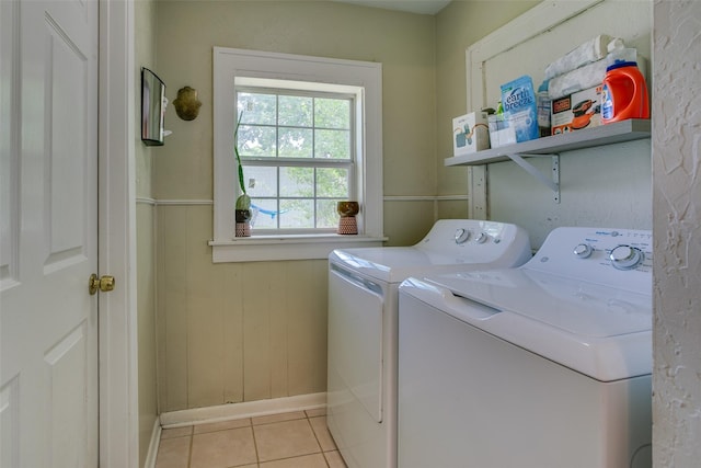 1211 Lansford Ave, Dallas, TX 75224 - laundry room featuring independent washer and dryer and light tile patterned floors