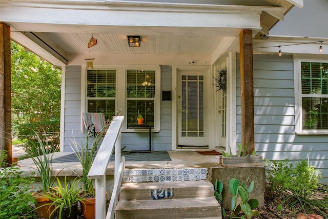 1211 Lansford Ave, Dallas, TX 75224 - doorway to property featuring a porch and a surveillance system