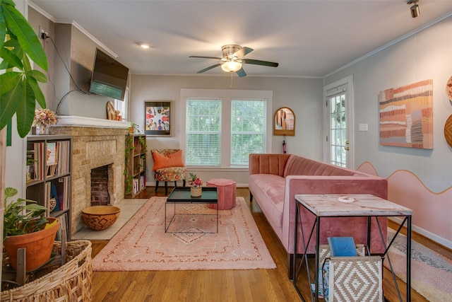 1211 Lansford Ave, Dallas, TX 75224 - living area with wood finished floors, plenty of natural light, ceiling fan, a brick fireplace, and crown molding