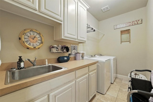 5820 Shiloh Forest Dr, Midlothian, TX 76065 - laundry area featuring cabinet space, washer and clothes dryer, and light tile patterned floors