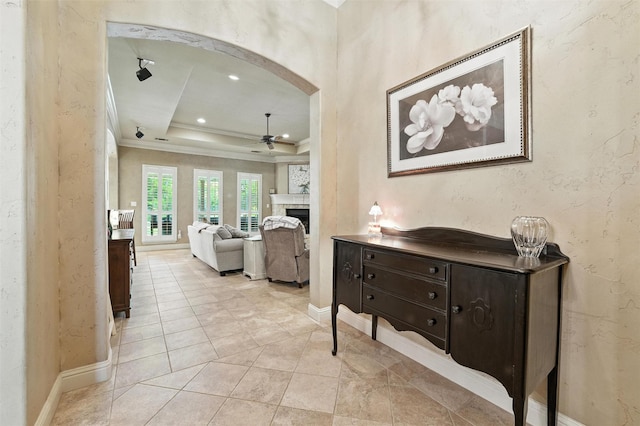 5820 Shiloh Forest Dr, Midlothian, TX 76065 - hall with crown molding, a tray ceiling, arched walkways, and recessed lighting