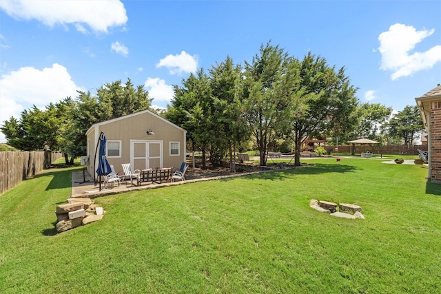 5820 Shiloh Forest Dr, Midlothian, TX 76065 - view of yard with a fire pit, a patio area, and an outdoor structure