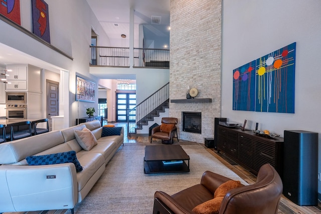 9901 Mi Tierra Dr, Fort Worth, TX 76179 - living area with a high ceiling, a fireplace, and stairs