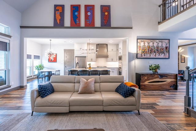 9901 Mi Tierra Dr, Fort Worth, TX 76179 - living room with a high ceiling, a chandelier, and wood finished floors