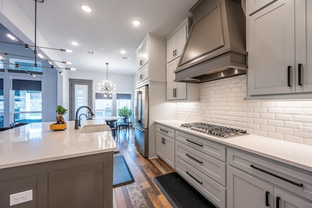 9901 Mi Tierra Dr, Fort Worth, TX 76179 - kitchen featuring a chandelier, appliances with stainless steel finishes, premium range hood, backsplash, and recessed lighting