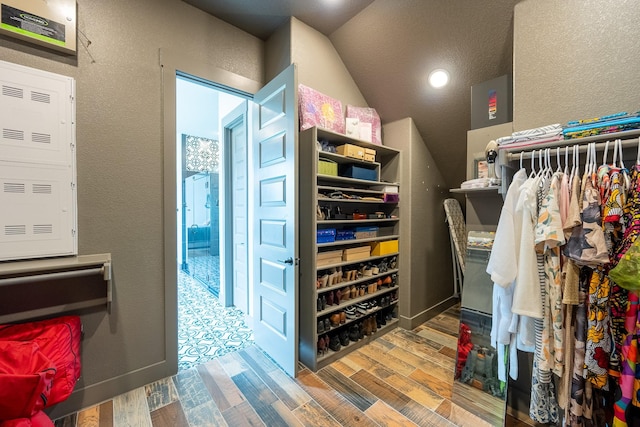9901 Mi Tierra Dr, Fort Worth, TX 76179 - walk in closet with wood finished floors and lofted ceiling