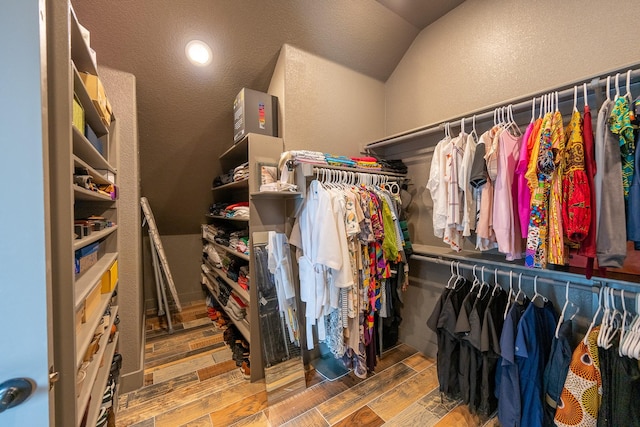9901 Mi Tierra Dr, Fort Worth, TX 76179 - spacious closet featuring vaulted ceiling and wood finished floors