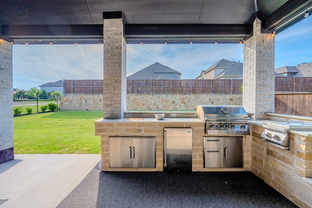 9901 Mi Tierra Dr, Fort Worth, TX 76179 - fenced backyard with an outdoor kitchen and a patio area