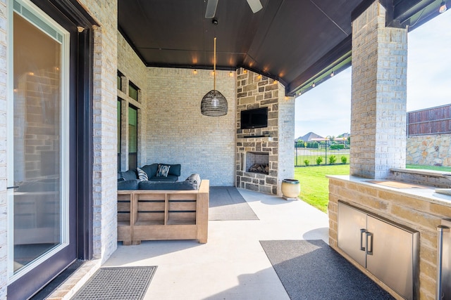 9901 Mi Tierra Dr, Fort Worth, TX 76179 - view of patio featuring an outdoor stone fireplace and ceiling fan