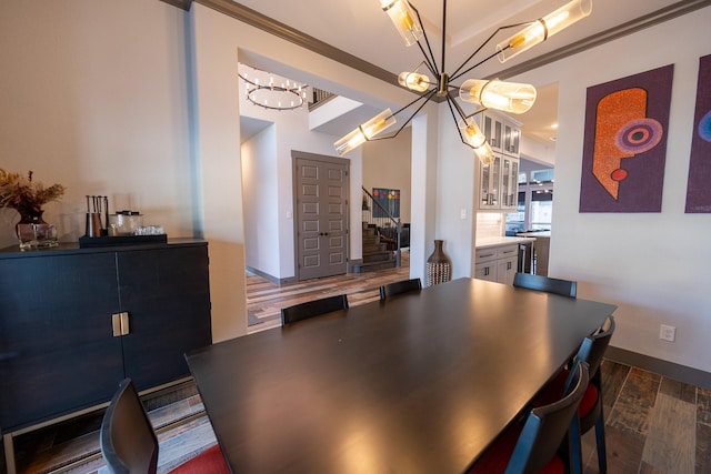 9901 Mi Tierra Dr, Fort Worth, TX 76179 - dining room featuring a chandelier, dark wood-style flooring, and stairway