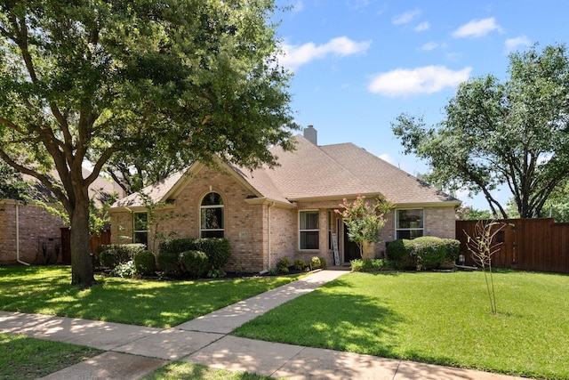 1617 Shadywood Ln, Flower Mound, TX 75028 - view of front of house featuring brick siding, a shingled roof, and a chimney