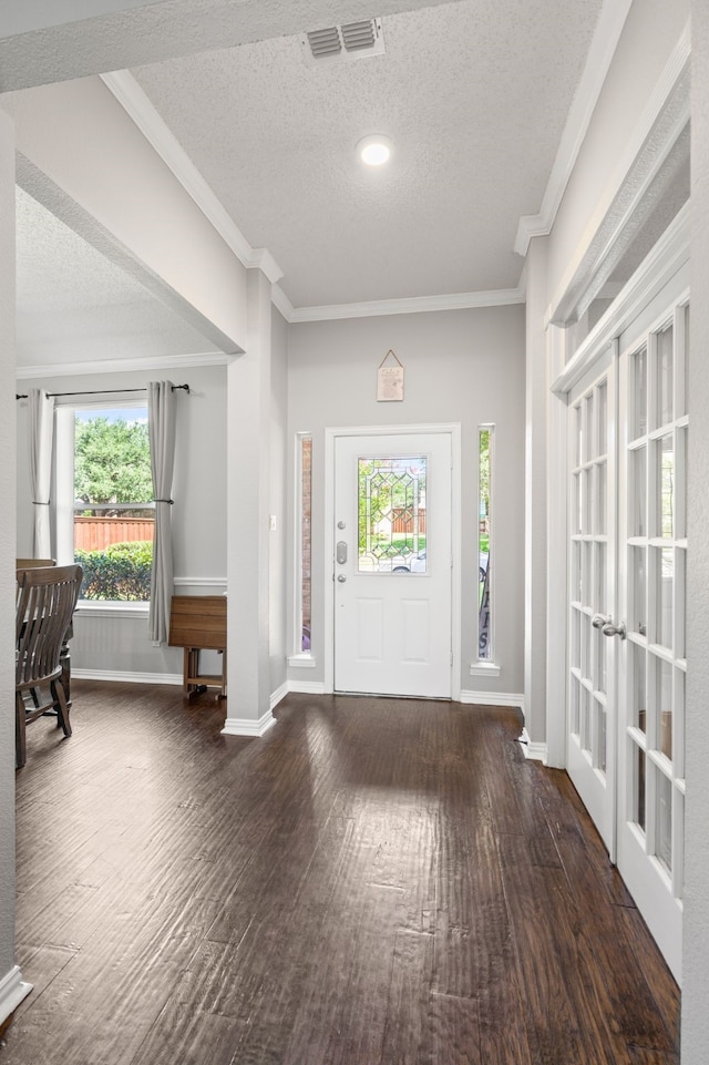 1617 Shadywood Ln, Flower Mound, TX 75028 - entrance foyer featuring plenty of natural light, wood finished floors, crown molding, and a textured ceiling