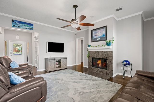 1617 Shadywood Ln, Flower Mound, TX 75028 - living area featuring a stone fireplace, dark wood finished floors, crown molding, and ceiling fan