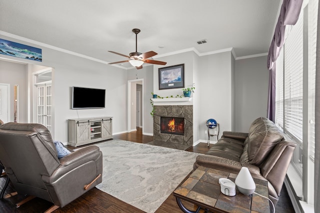1617 Shadywood Ln, Flower Mound, TX 75028 - living room with a fireplace, dark wood-style floors, crown molding, and a ceiling fan