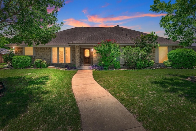 4120 Merriman Dr, Plano, TX 75074 - view of front facade featuring a lawn, a shingled roof, and brick siding