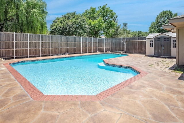 4120 Merriman Dr, Plano, TX 75074 - view of swimming pool with a patio, a shed, a fenced backyard, and a diving board