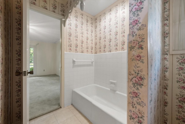 1008 Dobbins Rd, Corsicana, TX 75110 - bathroom featuring tile patterned floors, a tub, wainscoting, and ornamental molding