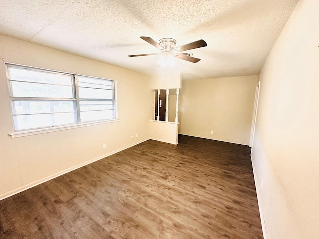 1220 Crestview Dr, Kaufman, TX 75142 - spare room with a textured ceiling, a ceiling fan, and wood finished floors