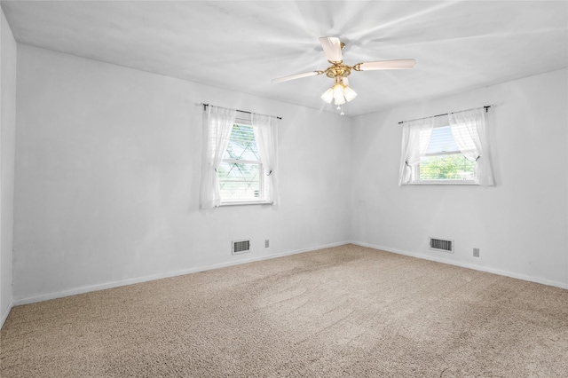 1748 Old Southmayd Rd, Sherman, TX 75092 - empty room featuring healthy amount of natural light, carpet, and a ceiling fan
