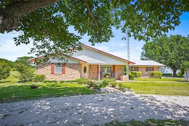 1748 Old Southmayd Rd, Sherman, TX 75092 - ranch-style house featuring a front yard, brick siding, and a porch