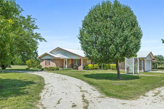 1748 Old Southmayd Rd, Sherman, TX 75092 - ranch-style house featuring curved driveway, a front lawn, brick siding, and a garage