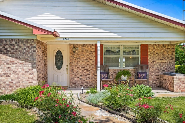 1748 Old Southmayd Rd, Sherman, TX 75092 - property entrance with covered porch, brick siding, and stone siding